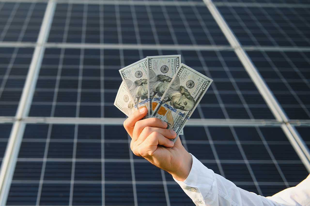 Homeowner in London reviewing the financial benefits and return on investment of installing a residential solar PV system.
